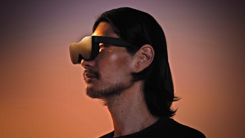 A person wearing the Sol Reader goggles, with their eyes illuminated by its e-paper displays.