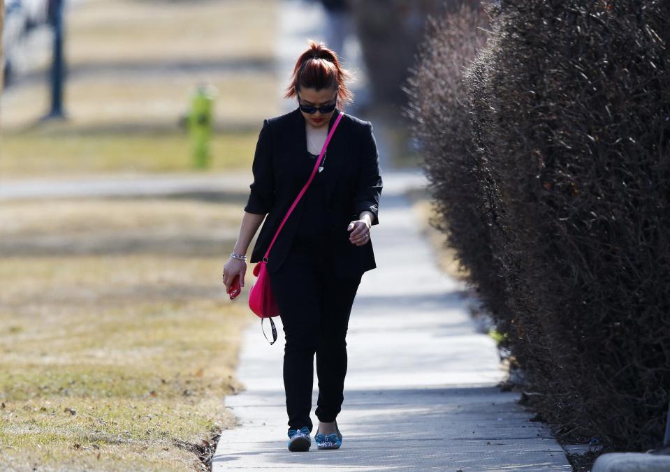 A guest arrives for the funeral of Jordan Segura in Calgary, Alberta April 21, 2014. Matthew de Grood has been charged with killing Segura and four of his friends at a house party last week in Calgary's worst mass murder in the history of the city, according to local media reports. REUTERS/Todd Korol (CANADA - Tags: CRIME LAW OBITUARY)