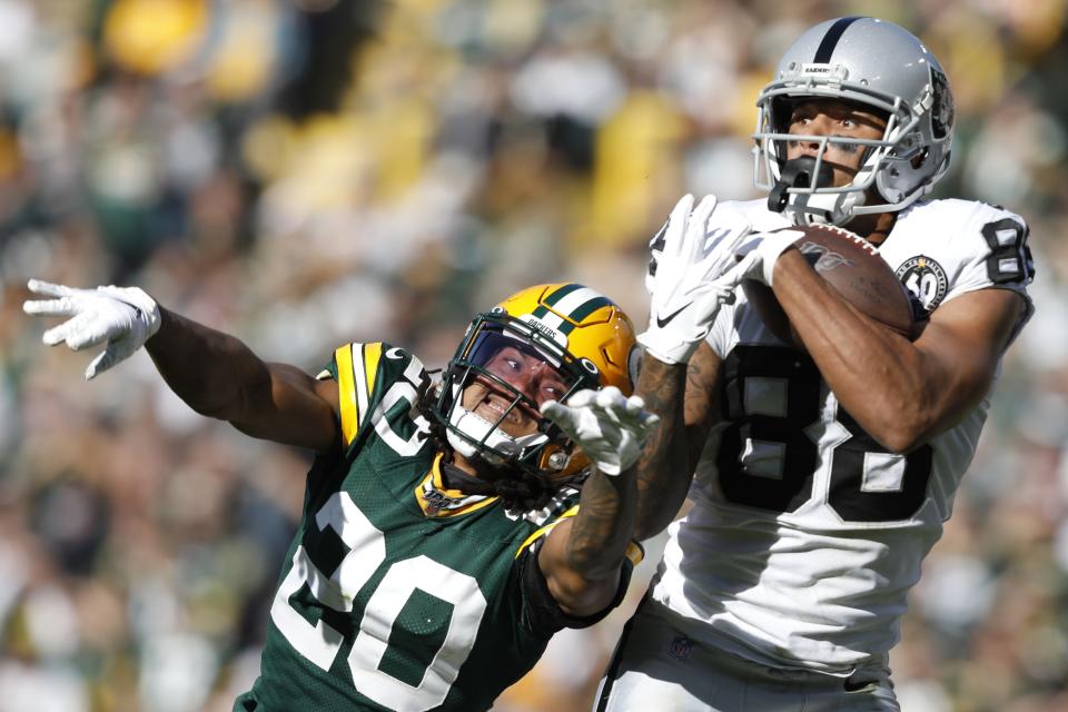 Oakland Raiders' Marcell Ateman catches a pass in front of Green Bay Packers' Kevin King during the second half of an NFL football game Sunday, Oct. 20, 2019, in Green Bay, Wis. (AP Photo/Jeffrey Phelps)