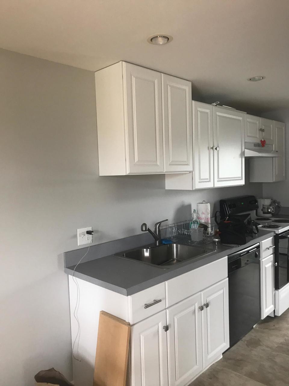 cabinet put in higher than the other cabinets in the kitchen