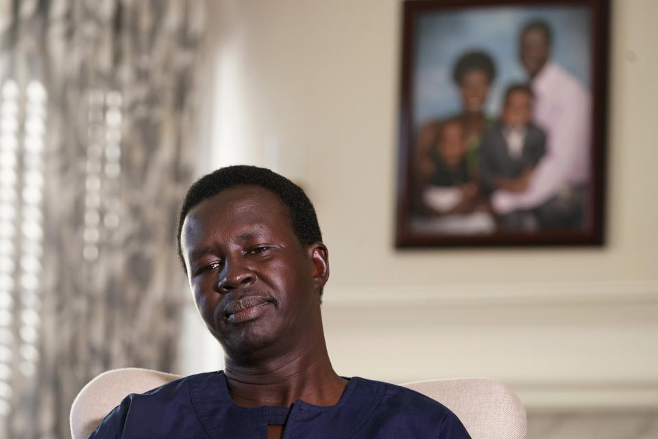 Jacob Mabil pauses during an interview at his home about his two nieces Wednesday, Nov. 8, 2023, in Haslet, Texas. Mabil is one of Sudan's "Lost Boys," and is trying to get his two nieces from African refugee camps to the U.S. to live with him and his family. (AP Photo/LM Otero)