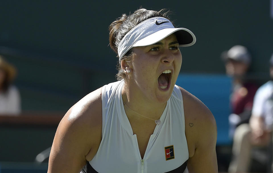 FILE - In this March 17, 2019, file photo, Bianca Andreescu, of Canada, celebrates after winning a game against Angelique Kerber, of Germany, during the women's final at the BNP Paribas Open tennis tournament in Indian Wells, Calif. Andreescu heads to the U.S. Open with a career-best ranking of No. 14 and coming off a hard-court title in Toronto. (AP Photo/Mark J. Terrill, File)