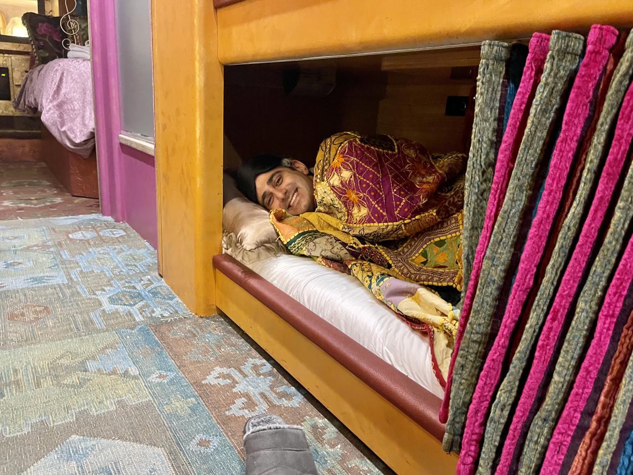 My husband thoroughly enjoyed his nap in one of the three bunk beds aboard the bus. (Photo: Carly Caramanna)