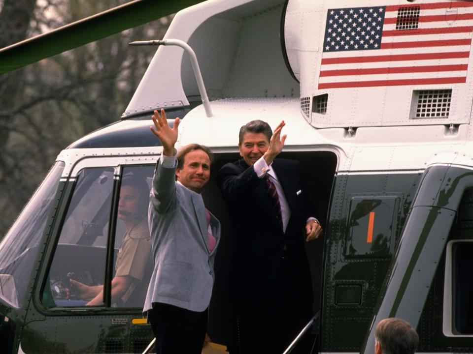 Ronald Reagan with son Michael Reagan boarding Marine One in 1988