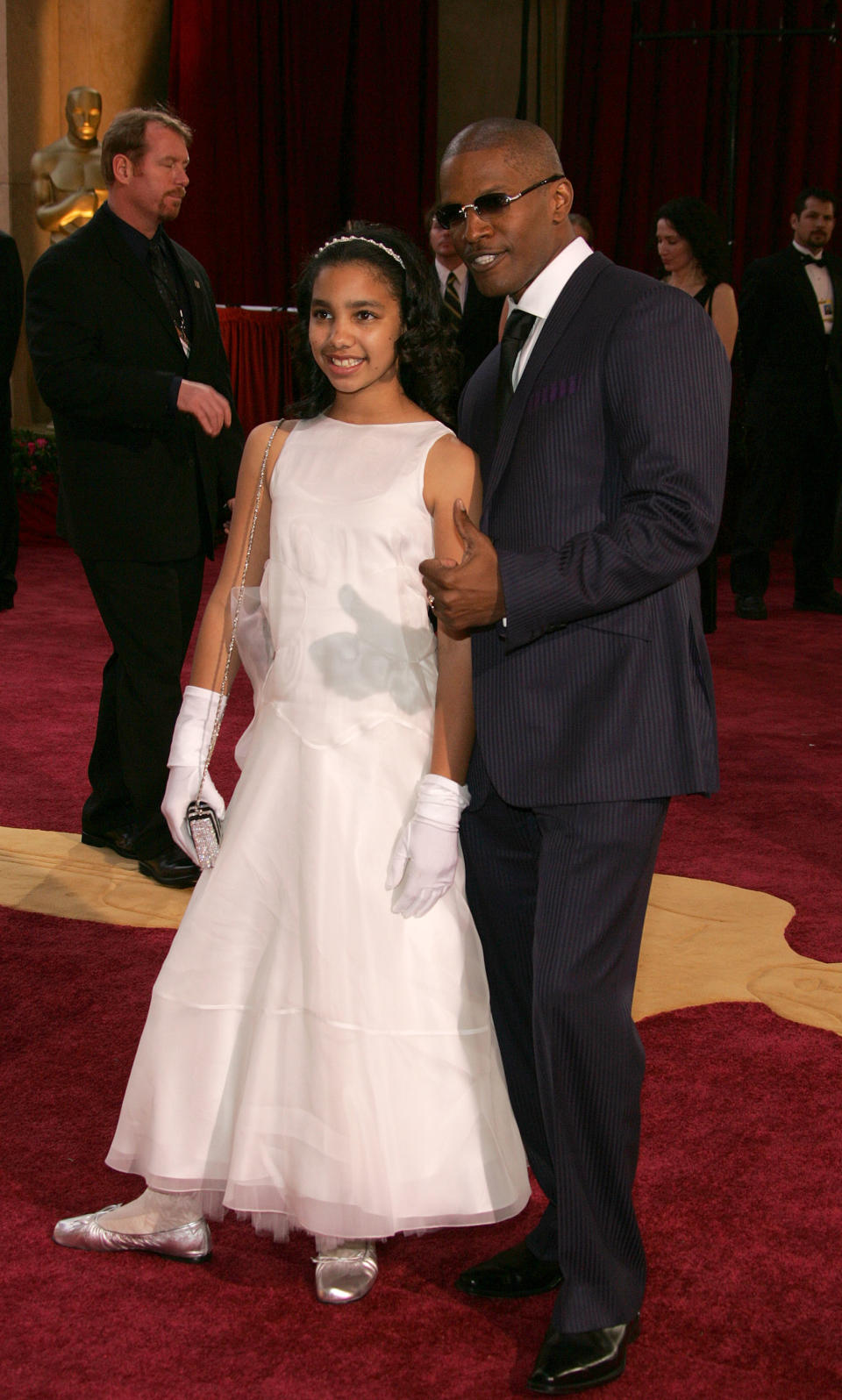 HOLLYWOOD - FEBRUARY 27: Actor Jamie Foxx nominated for Best Actor in a Supporting Role for his performance in "Collateral" and for Best Actor in a Leading Role for his performance in "Ray" arrives with his daughter Corrine Marie for the 77th Annual Academy Awards at the Kodak Theater on February 27, 2005 in Hollywood, California.    (Photo by Vince Bucci/Getty Images)