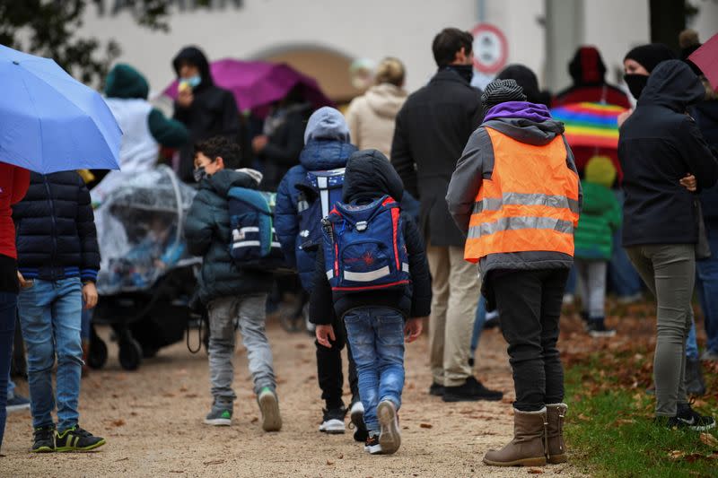 People take part in a protest against the government's measures prior to an ordered lock-down due to the further spreading of the coronavirus disease (COVID-19) in Pfarrkirchen