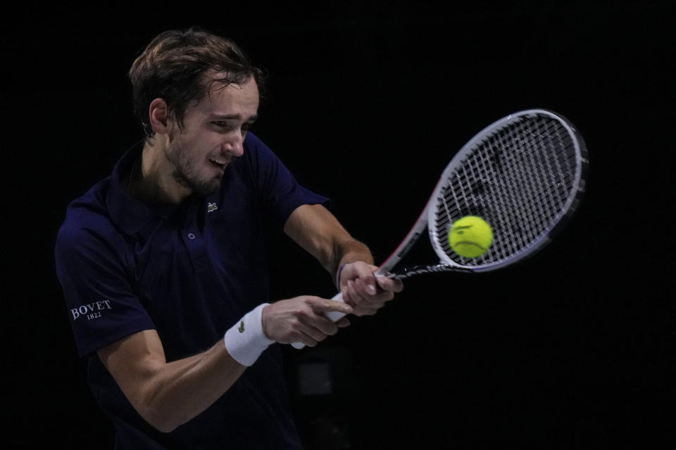 Russian Tennis Federation's Daniil Medvedev returns the ball to Croatia's Marin Cilic during their Davis Cup tennis finals at Madrid Arena in Madrid, Spain, Sunday, Dec. 5, 2021. (AP Photo/Manu Fernandez)