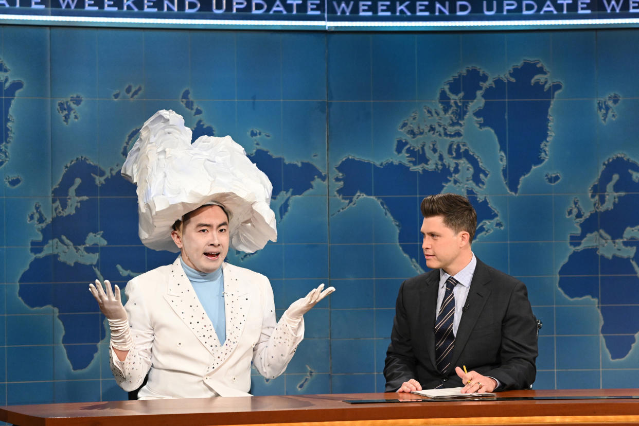 Bowen Yang as 'The Iceberg That Sank The Titanic' and anchor Colin Jost during Weekend Update on Saturday, April 10, 2021. (Will Heath / NBC)