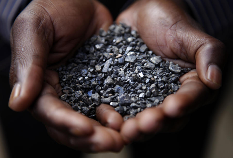 A Miner holds tantalum stones in Numbi, in South Kivu Province, Democratic Republic of Congo, in an April 28, 2010 file photo. / Credit: Kuni Takahashi/Getty
