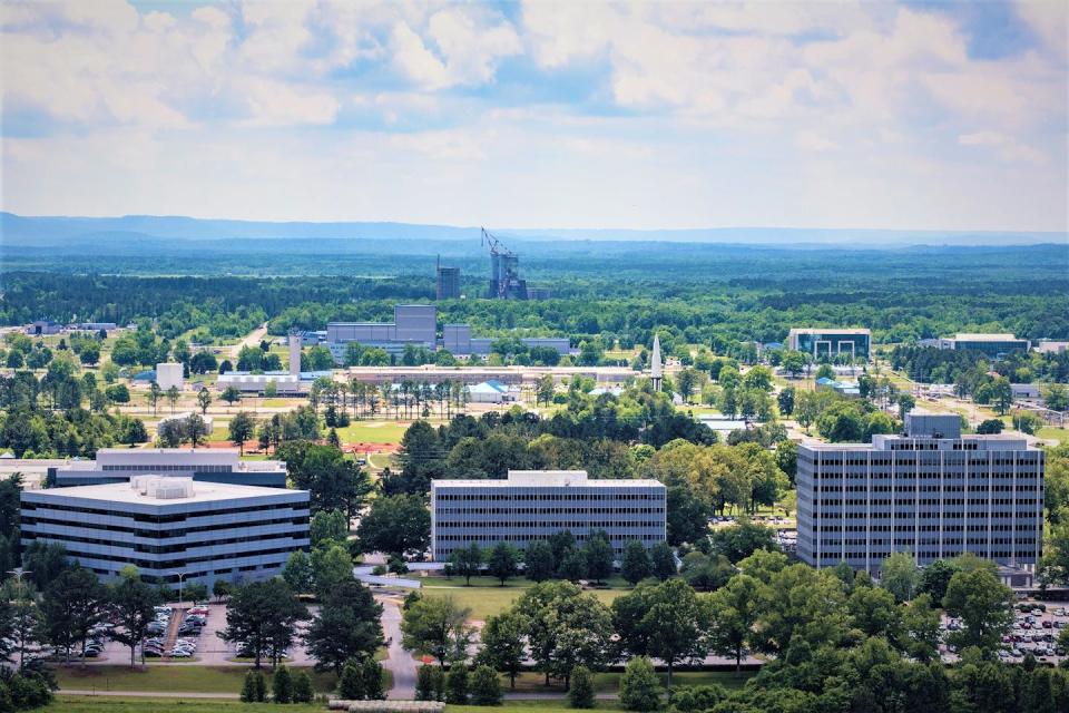 Aerial view of three buildings.