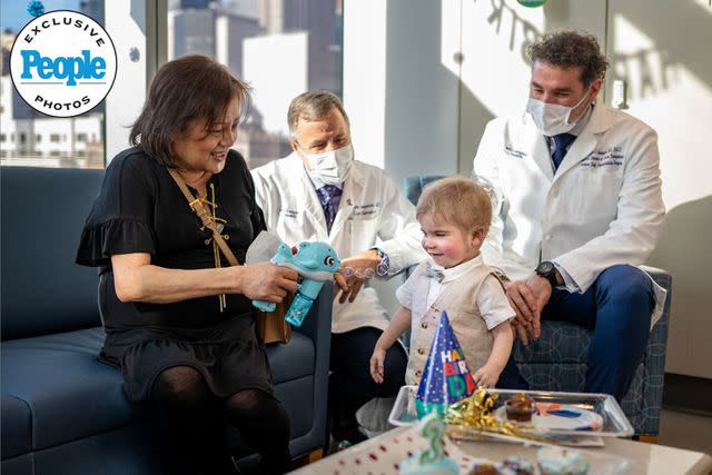 <p>Mateo Salcedo / Hassenfeld Children's Hospital at NYU Langone</p> Susana and Cooper with their surgeons Dr. Adam Griesemer (left) and Dr. Karim Halazun