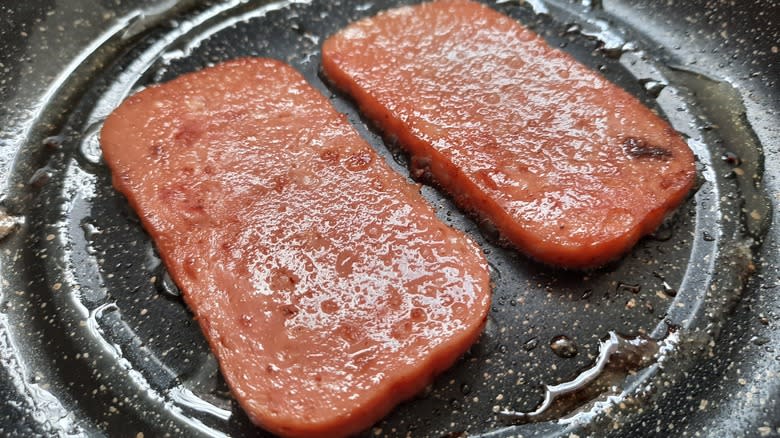 Closeup of cooking spam slices
