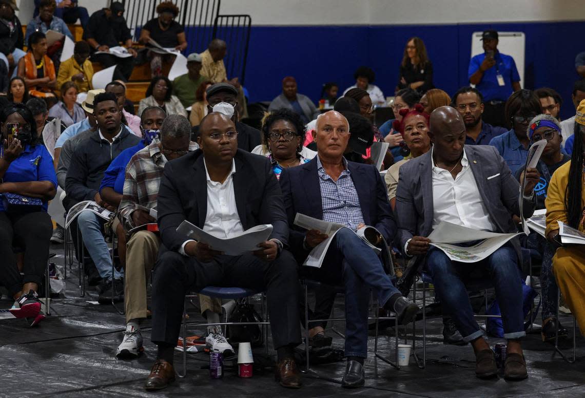 Community members listen to a presentation during a town hall discussing the potentials for county-owned land known as the Poinciana Industrial Park on Monday, Feb. 6, 2023, at the Gwen Cherry Park gymnasium..