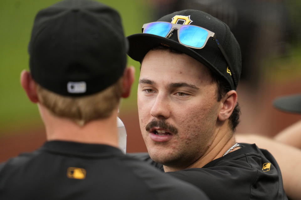 Pittsburgh Pirates pitcher Paul Skenes, right, talks with pitcher Mitch Keller in the dugout during the team's baseball game against the Los Angeles Dodgers in Pittsburgh, Tuesday, June 4, 2024. (AP Photo/Gene J. Puskar)