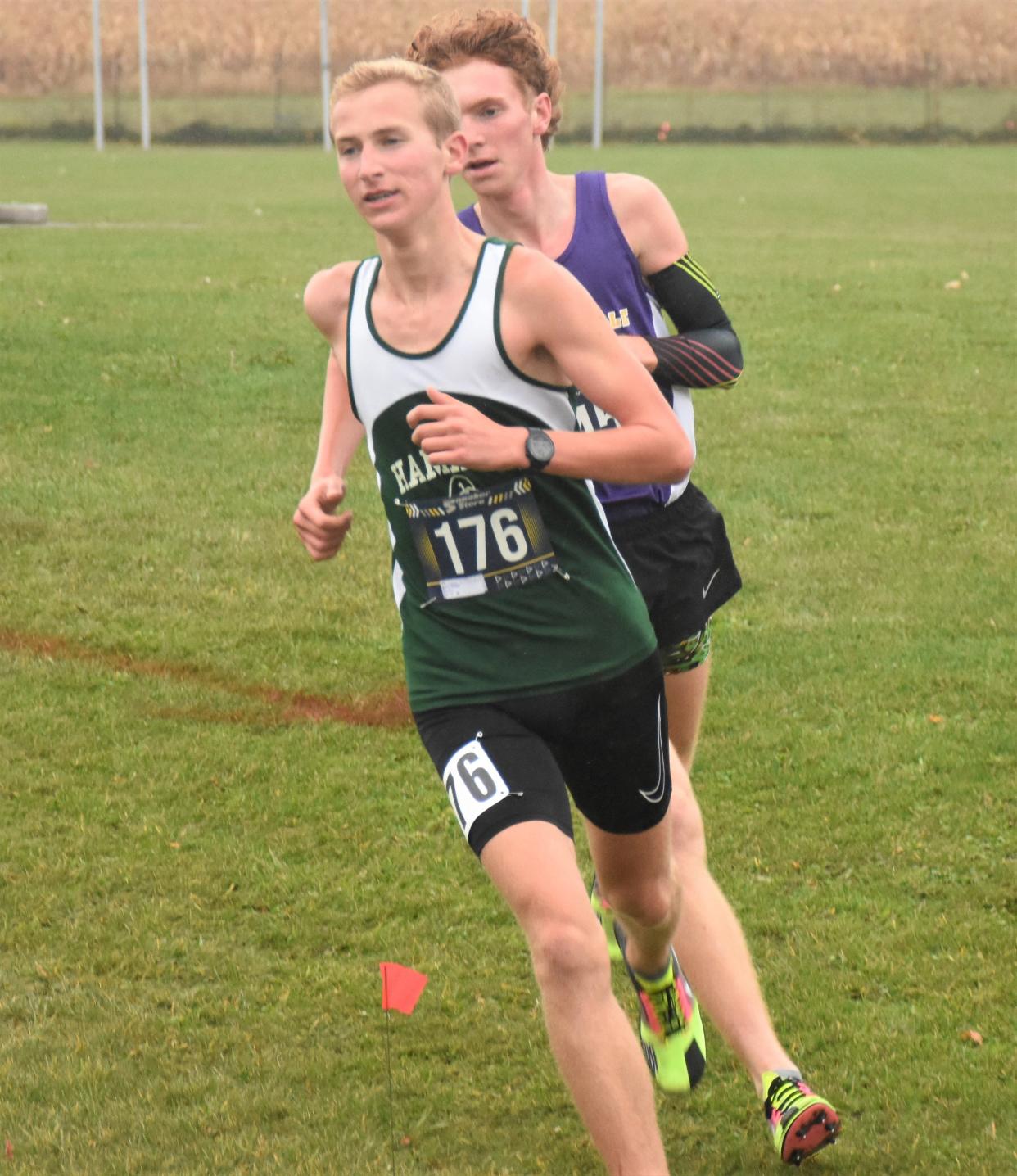 Hamilton's Joseph Berry (176) leads Waterville's Logan Baker around a turn on the Mt. Markham course at the 2023 Center State Conference championship meet. Berry ran 14th and Baker 27th Saturday in the Class D race at the state meet.