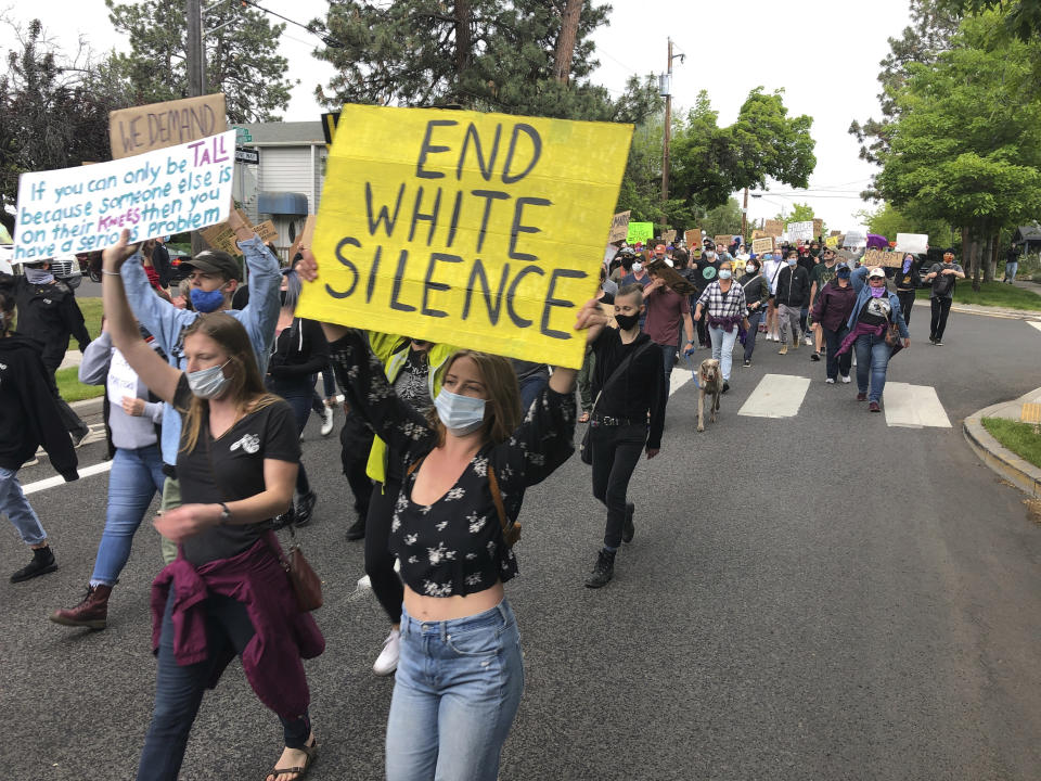 Demonstrators march Saturday, June 6, 2020, in Bend, Ore., to protest racism and police brutality. (AP Photo/Andrew Selsky)