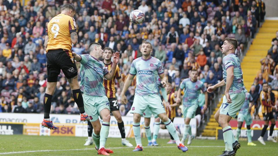 Andy Cook scores for Bradford against Carlisle