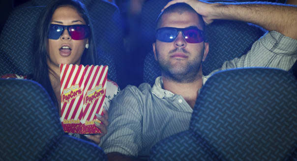 Couple watching  movie in cinema