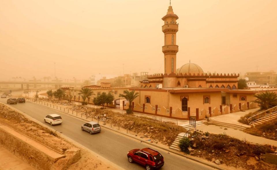 Motorists drive their vehicles through a sandstorm in Libya's eastern city of Benghazi - April 22, 2024