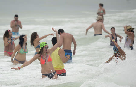 People enjoy the water during spring break festivities in Panama City Beach, Florida March 12, 2015. REUTERS/Michael Spooneybarger