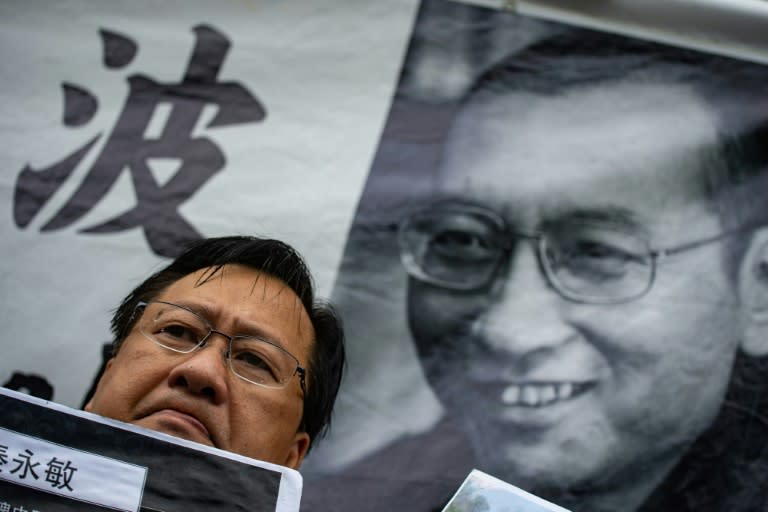 In Hong Kong on Friday, activists attached a picture of Liu to the wall outside the Chinese government's office in the city