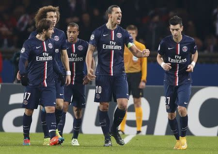 Paris St Germain's Zlatan Ibrahimovic (2ndR) reacts after he scored against Ajax Amsterdam during their Champions League Group F soccer match at the Parc des Princes Stadium in Paris November 25, 2014. REUTERS/Charles Platiau