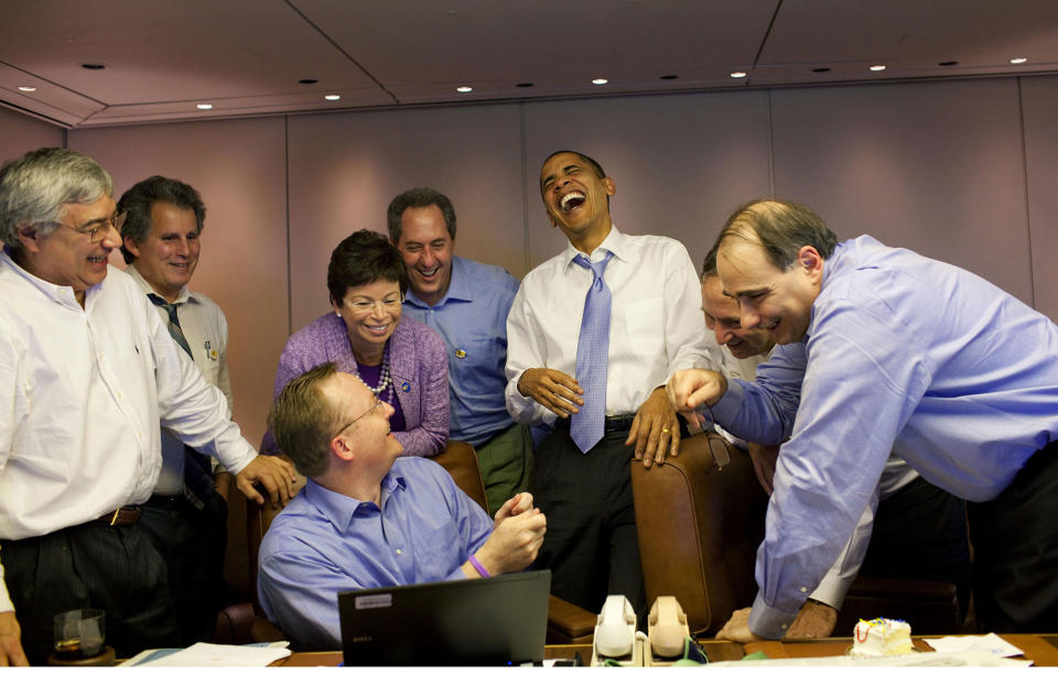 <p>"We were on Air Force One heading to the Summit of the Americas in Singapore on November 14, 2009. Since the 1990's, the host country for this Summit chooses a shirt that all heads of state wear to the formal ceremony. White House press secretary Robert Gibbs was showing the President pictures of past leaders wearing—shall we say—not the most dignified of shirts. At the Summit, the President joked that he looked forward to hosting the 2011 Summit in Hawaii, where everyone would have to wear Hawaii shirts and grass skirts." (Pete Souza/The White House) </p>