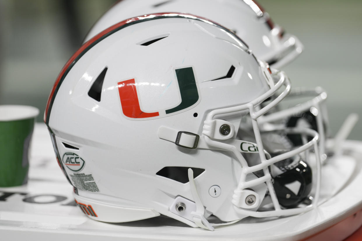 MIAMI GARDENS, FL - NOVEMBER 26: A Miami Hurricanes helmet rests near the team bench during the game between the Pitt Panthers and the Miami Hurricanes on Saturday, November 26, 2022 at Hard Rock Stadium in Miami Gardens, Fla. (Photo by Peter Joneleit/Icon Sportswire via Getty Images)