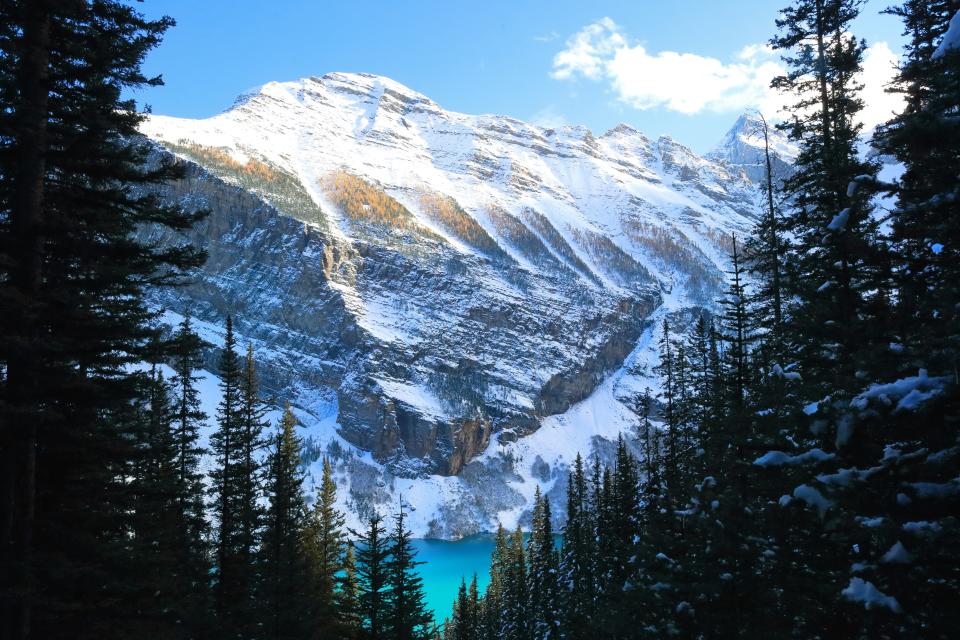 Snowcapped mountains behind Lake Louise in Banff National Park in Alberta, Canada