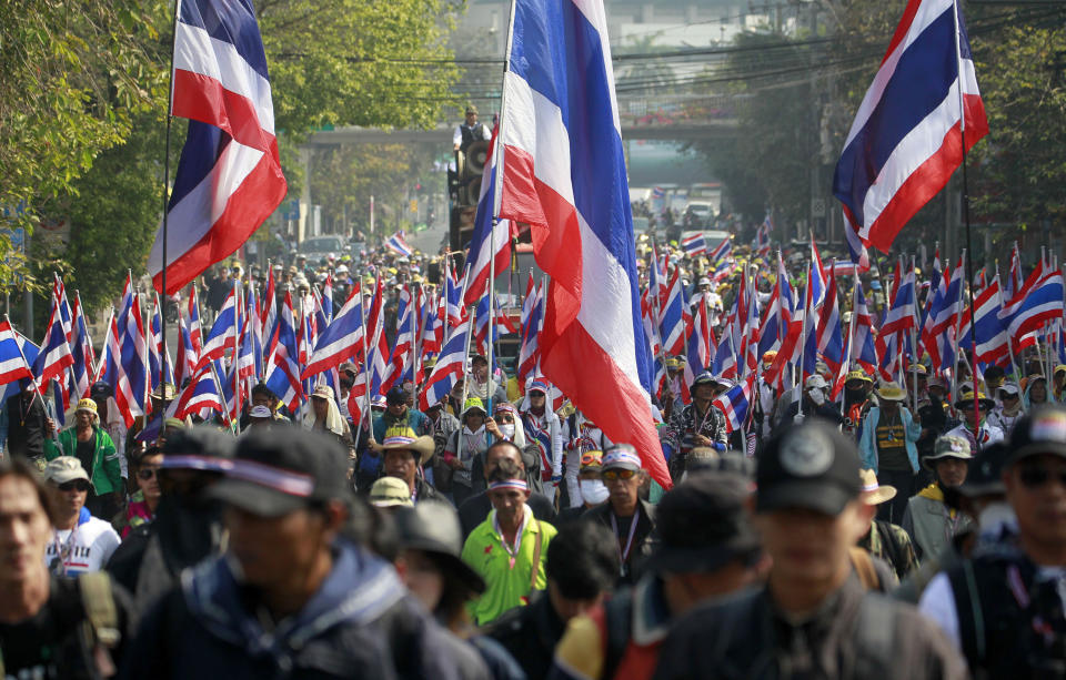 Anti-government protesters fill a street during a march Friday, Jan. 24, 2014 in Bangkok. Thailand’s Constitutional Court ruled Friday that nationwide elections scheduled for Feb. 2 can legally be delayed. (AP Photo/Wason Wanichakorn)