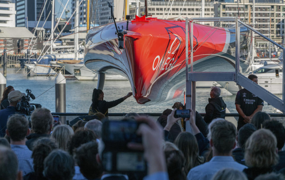 In this photo released by Emirates Team New Zealand, Emirates Team New Zealand launch their America's Cup AC75 boat 2, Te Rehutai, Maori for Sea Spray - at the Viaduct Harbour in Auckland, New Zealand, Thursday, Nov. 19, 2020. The sleek 75-foot monohull boat which will defend the America's Cup when the venerable sailing trophy is contested in March for the 36th time since 1856. (Emirates Team New Zealand via AP)