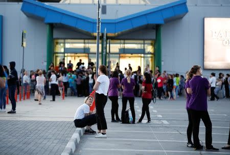 People stand outside a mall that was evacuated in the World Cup city of Samara, Russia June 28, 2018. REUTERS/Carlos Garcia Rawlins