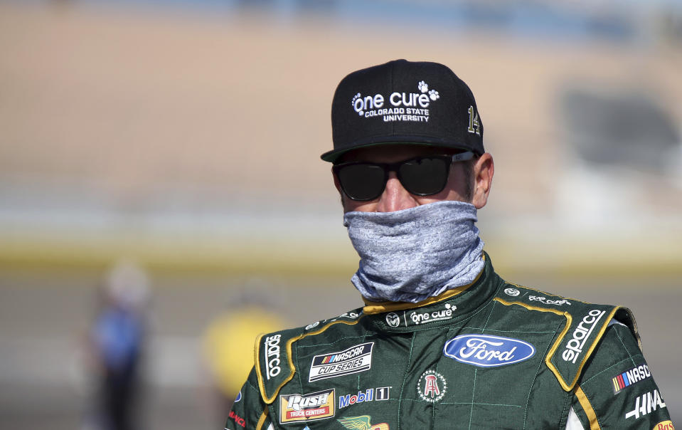 Clint Bowyer walks to his race car before a NASCAR Cup Series auto race Sunday, Sept. 27, 2020, in Las Vegas. (AP Photo/Isaac Brekken)