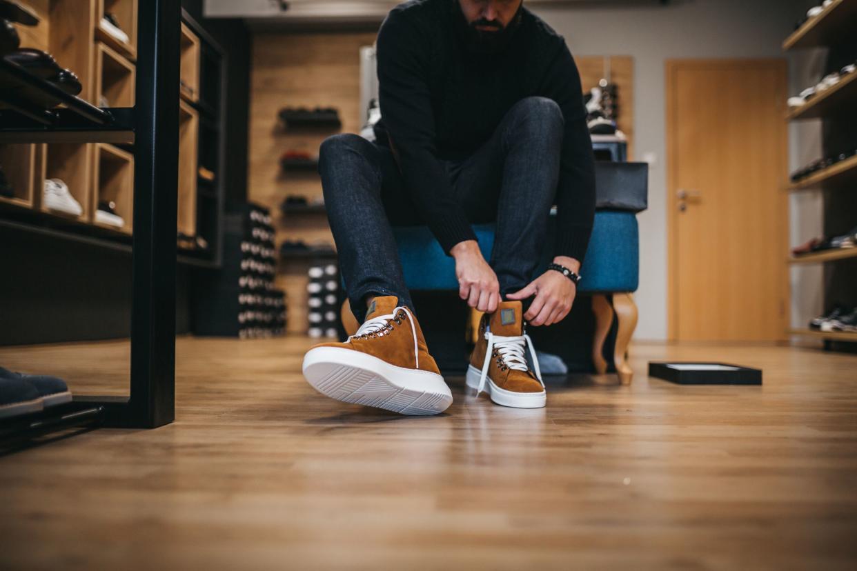 Young man shopping shoes