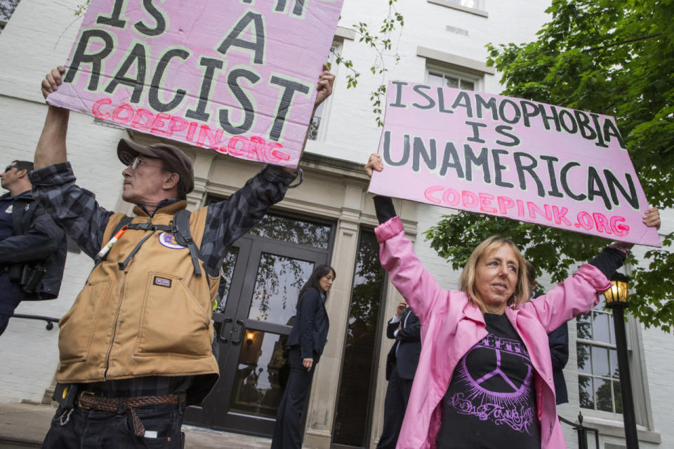 Anti-Trump protesters demonstrate against the GOP’s presumptive presidential nominee at the entrance of the Republican National Committee Headquarters on Capitol Hill in Washington, Thursday, May 12, 2016, as Donald Trump meets with House Speaker Paul Ryan of Wisconsin. (AP Photo/J. Scott Applewhite)