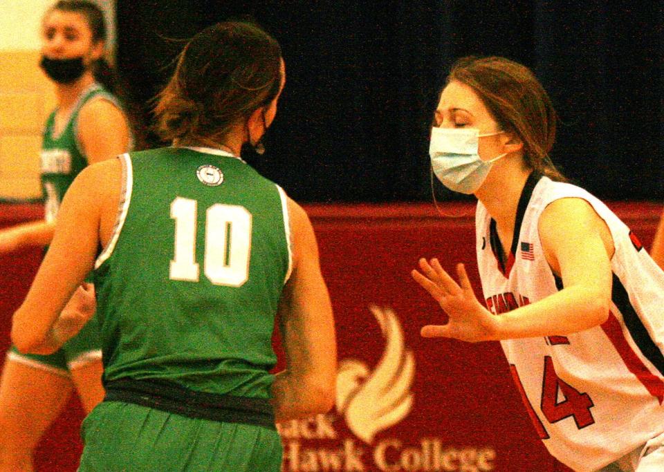 Kewanee's Lariss Meyer dees up against Geneseo Alisande Rapps.