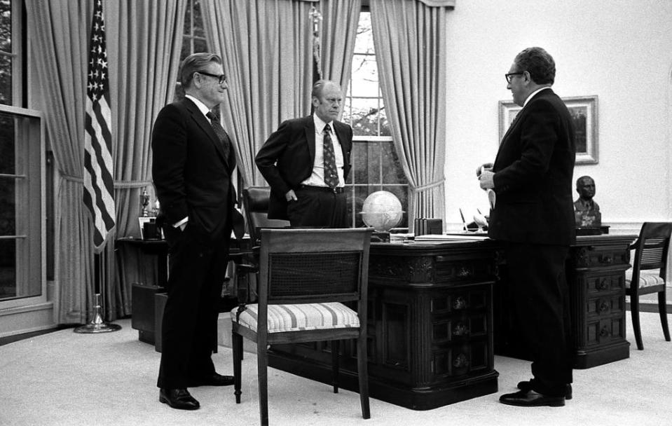 President Gerald R. Ford meeting in the Oval Office with Secretary of State Henry Kissinger and Vice President Nelson Rockefeller to discuss the American evacuation of Saigon.