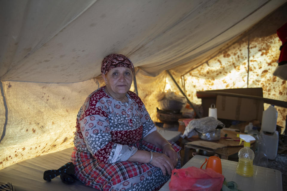 Khadija, a woman was was displaced by the earthquake prepares for Iftar to break her Ramadan fast in her tent, in Amizmiz, near Marrakech, Thursday, April 4, 2024. (AP Photo)