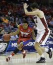 Dayton guard Vee Sanford (43) moves the ball on Stanford center Stefan Nastic (4) during the first half in a regional semifinal game at the NCAA college basketball tournament, Thursday, March 27, 2014, in Memphis, Tenn. (AP Photo/Mark Humphrey)