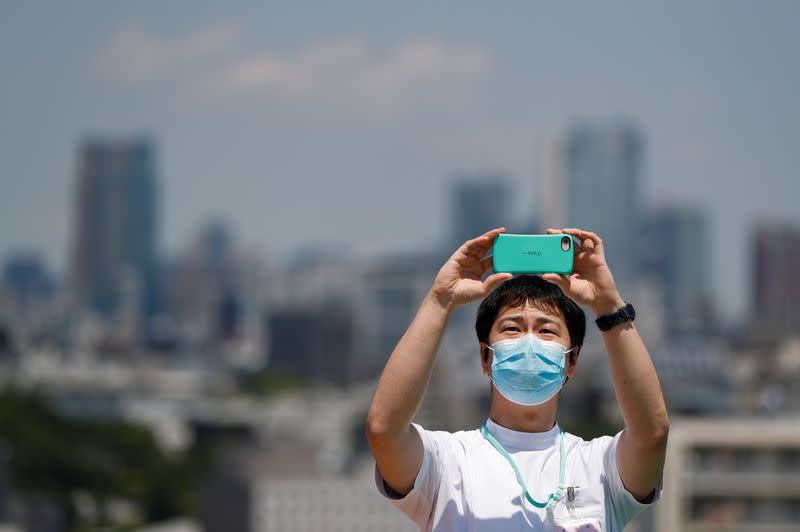 Japan Air Self-Defense Force stages a flyover to salute the medical workers at the frontline of the fight against the coronavirus disease (COVID-19), in Tokyo