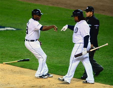 Oct 16, 2013; Detroit, MI, USA; Detroit Tigers right fielder Torii Hunter (48) celebrates with first baseman Prince Fielder (28) after scoring against the Boston Red Sox during the second inning in game four of the American League Championship Series baseball game at Comerica Park. Andrew Weber-USA TODAY Sports