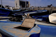 Boats used by migrants to cross the Mediterranean Sea are pictured in the Tunisian coastal town of Zarzis, Tunisia, Saturday June 12, 2021. Zarzis is a port city where migrants bound for Europe frequently wind up after their boats go astray in the Mediterranean's uncertain currents. One of its cemeteries is already filled with those who died trying to make the crossing. (AP Photo/Mehdi El Arem)