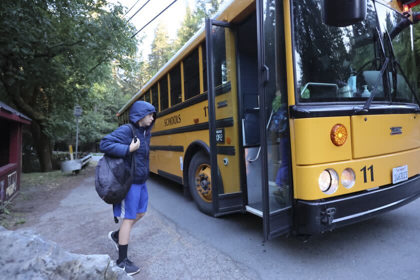 CAMP MEEKER CA MAY 31, 2022 - High school students wait for the bus on Tuesday, May 31, 2022 in Camp Meeker, Calif. (Paul Kuroda/For The Times)