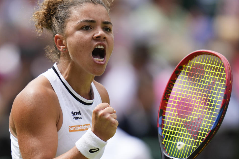 Jasmine Paolini of Italy reacts after winning a point against Barbora Krejcikova of the Czech Republic during the women's singles final at the Wimbledon tennis championships in London, Saturday, July 13, 2024. (AP Photo/Kirsty Wigglesworth)