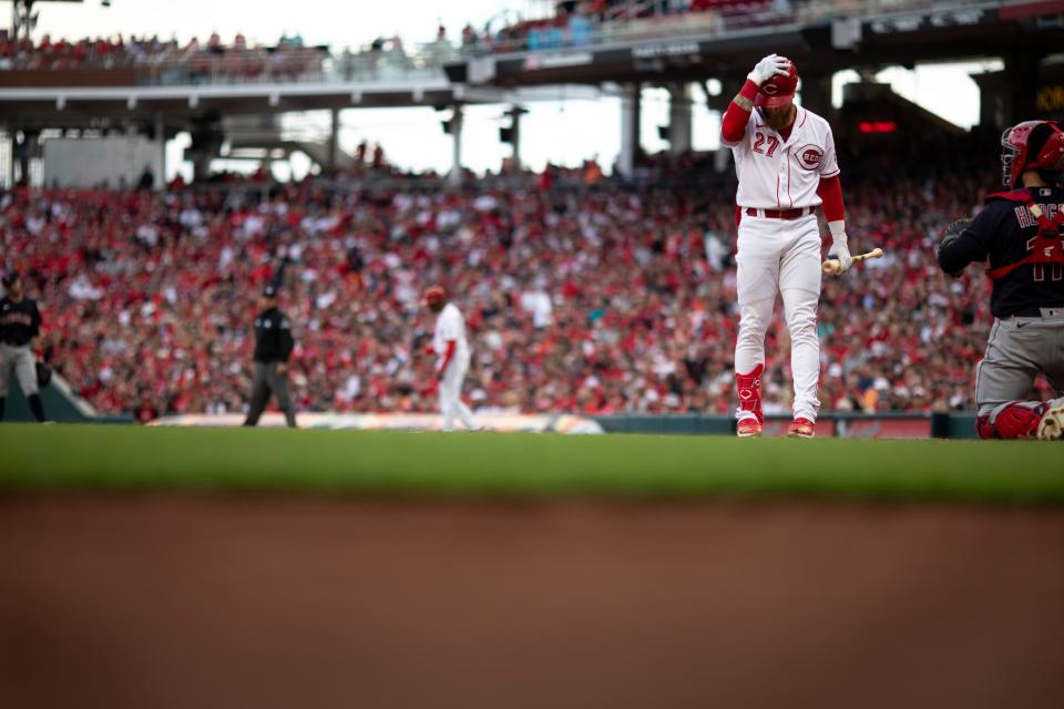 Cincinnati Reds left fielder Jake Fraley (27) reacts to a swing and a miss in the eighth inning of the MLB interleague game  at Great American Ball Park in Cincinnati, Tuesday, April 12, 2022. Cleveland Guardians defeated Cincinnati Reds 10-5.