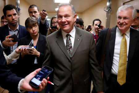FILE PHOTO: Alabama Republican candidate for U.S. Senate Roy Moore speaks with reporters as he visits the U.S. Capitol in Washington, U.S. October 31, 2017. REUTERS/Jonathan Ernst/File Photo