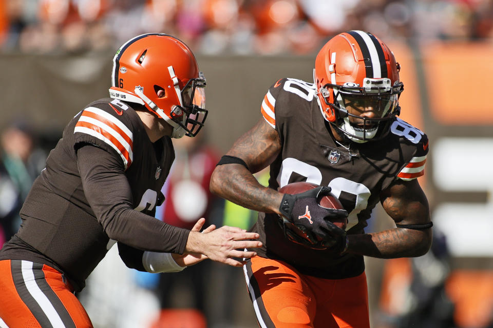 Cleveland Browns quarterback Baker Mayfield (6) hands the ball off to wide receiver Jarvis Landry (80) during the first half of an NFL football game against the Pittsburgh Steelers, Sunday, Oct. 31, 2021, in Cleveland. (AP Photo/Ron Schwane)