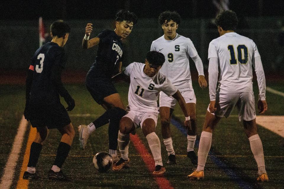 Delcastle junior Diego Pedroza-Luna (7) battles for control of the ball against Salesianum senior Paolo Magat (11) during the DIAA Division I Boys Soccer Tournament semifinals at Caravel's Bob Peoples Stadium in Glasgow, Tuesday, Nov. 14, 2023. Salesianum won 4-1.