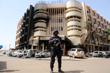 A soldiers stands guard in front of Splendid Hotel in Ouagadougou, Burkina Faso, January 17, 2016, a day after security forces retook the hotel from al Qaeda fighters who seized it in an assault that killed two dozen people from at least 18 countries and marked a major escalation of Islamist militancy in West Africa. REUTERS/Joe Penney
