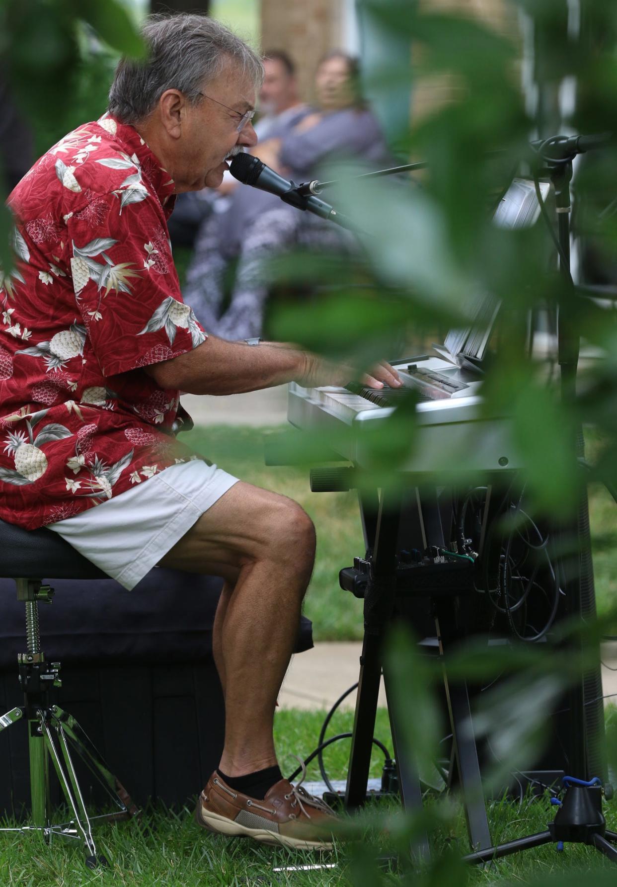 Dave Bonivtch performs outside on the lawn of the Earl Scruggs Center in downtown Shelby Saturday morning, June 26, 2021, during the 18th annual Art of Sound Festival.